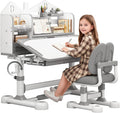 Kids Learning Desk and Chair Set, Adjustable Study Table for Ages 3-12 with Hand Crank Lift, 50° Tilting Desktop, Bookshelf, Drawer & Ergonomic Chair for Homework and Drawing (Grey)